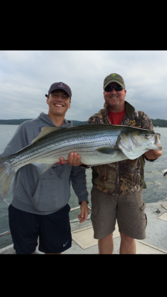 Check out this catch! This large fish is called a striper. 